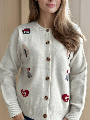 White acrylic button-up cardigan with embroidered storybook motifs like houses and hearts.