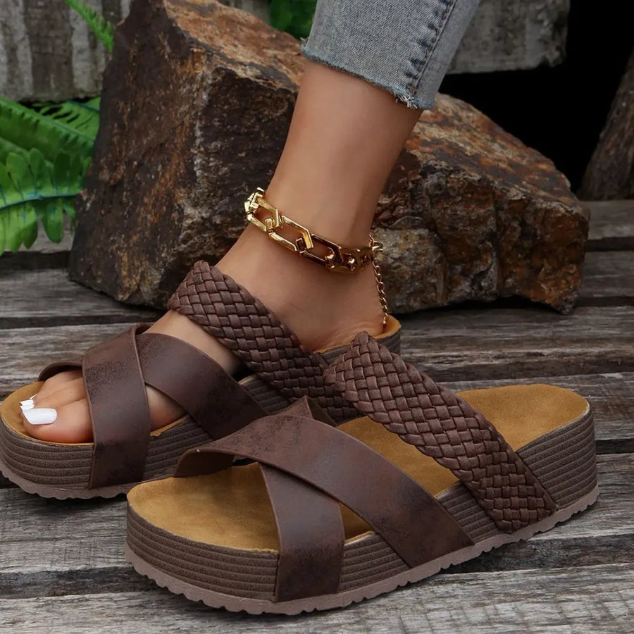 Brown Zenith strappy platform sandals with crisscross straps and braided detail.
