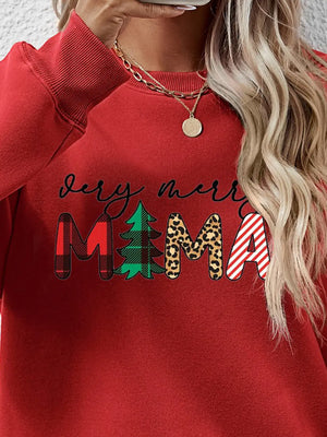 Red long sleeve sweater with "Very Merry Mama" graphic in plaid, tree, leopard, and stripe patterns.