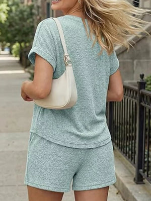 Light blue relaxed two-piece set with pocketed top and shorts, casual women's outfit