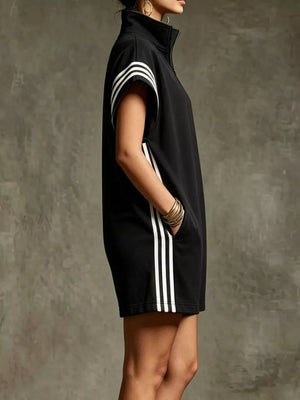 Black zip-up romper with white stripes on sleeves and sides, featuring pockets.
