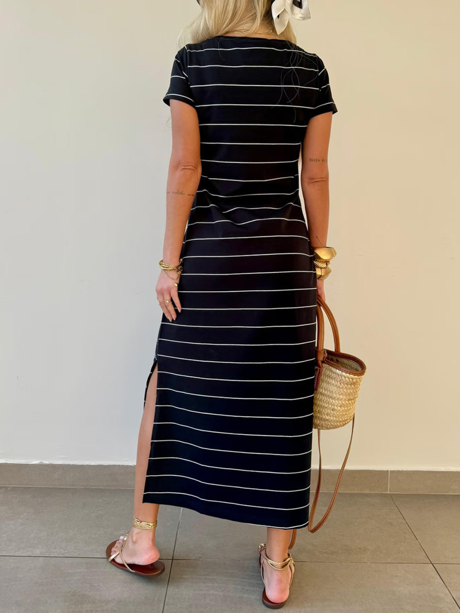 Black and white striped midi t-shirt dress with side slit and short sleeves.
