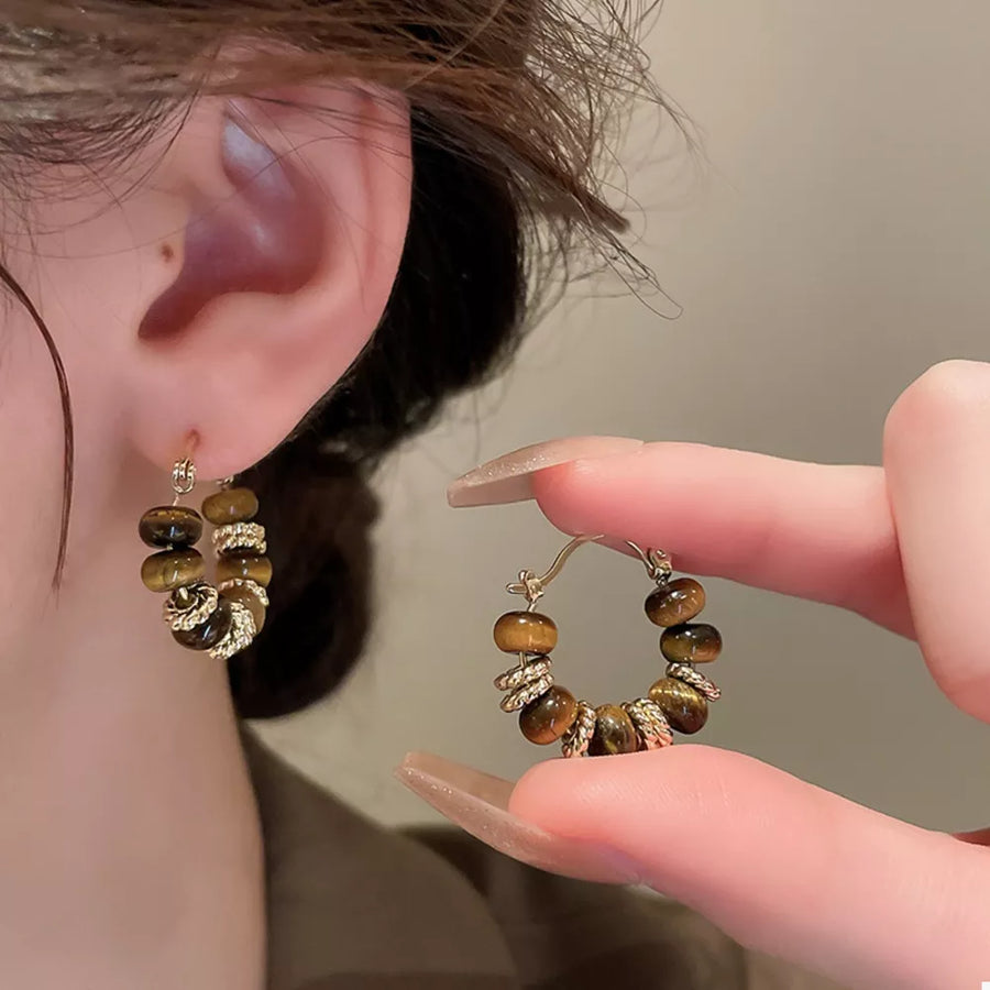 Tiger' earrings in Style C with circular silhouette