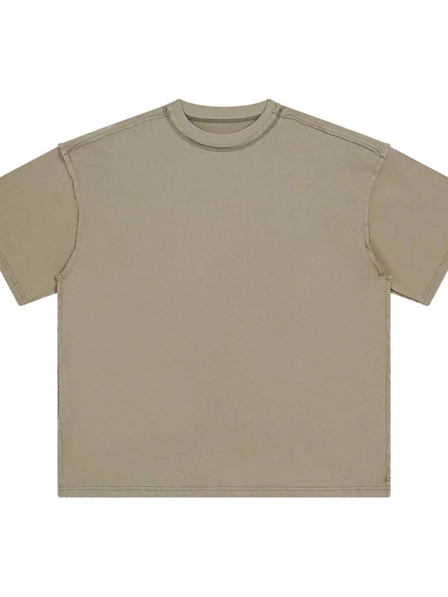 Beige washed cotton t-shirt with raw seams and crew neck.