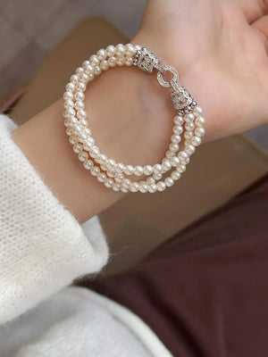 Synthetic Pearl,Alloy,Zircon Care instructions: Avoid wearing during exercise, a bracelet in Silver with layered silhouette