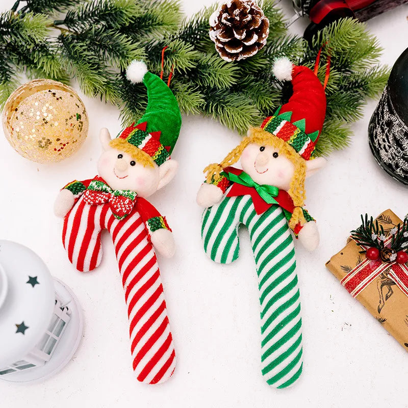 Elf cane holiday ornaments in red and green candy cane shapes with cheerful faces and festive hats.