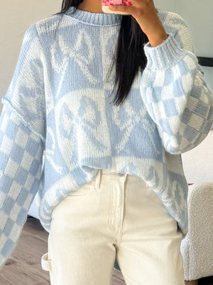 100% polyester Care instructions: Machine wash cold pullover sweater in Light Blue And White with oversized silhouette