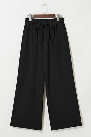 Black cropped pants with drawstring elastic waist and wide legs.