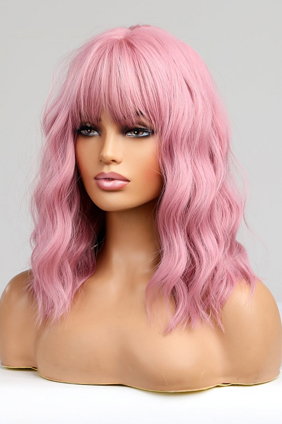 Pink bob wig with bangs and wavy texture