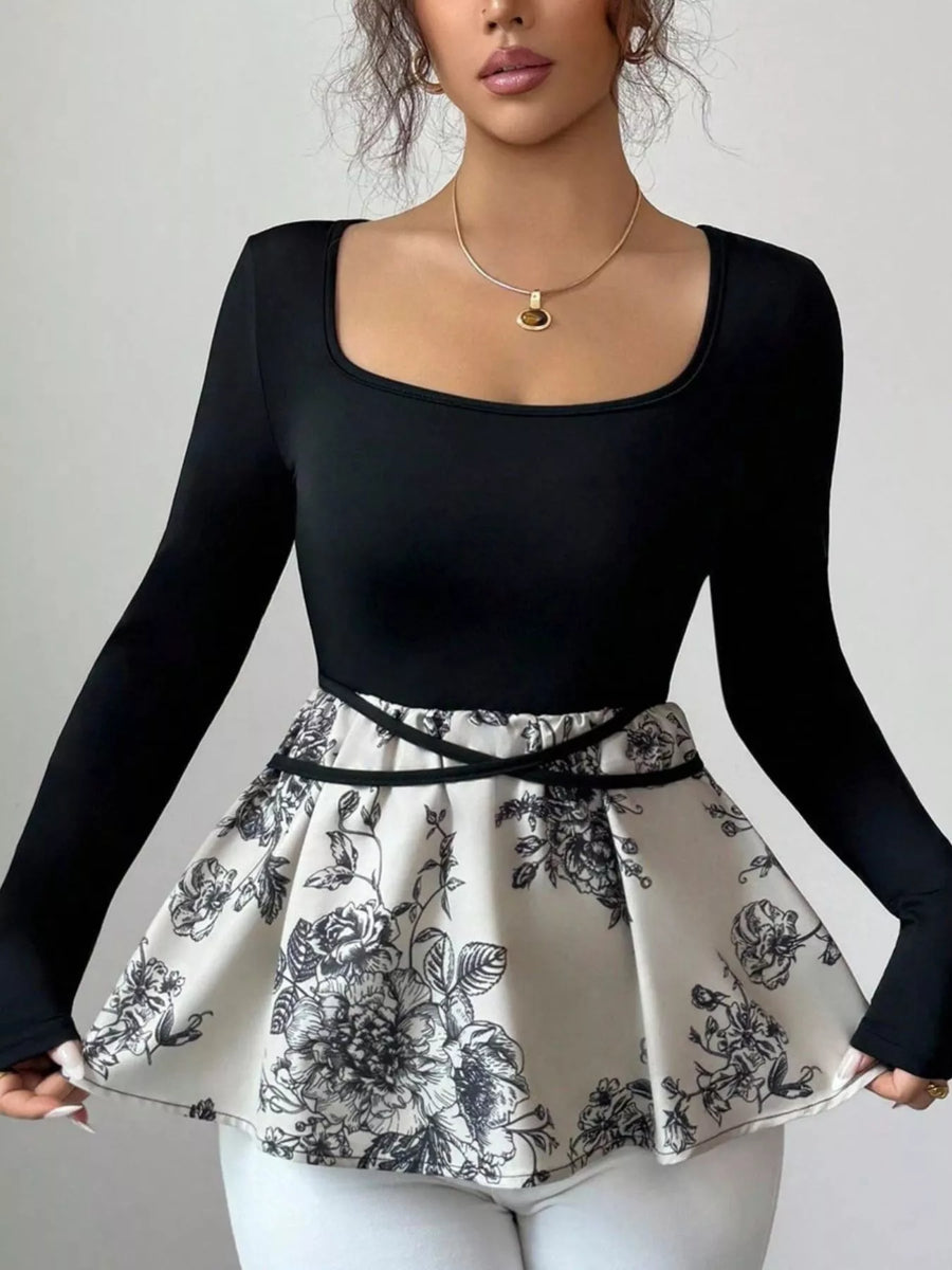Black long-sleeve top with square neckline and peplum hem featuring a black floral print.