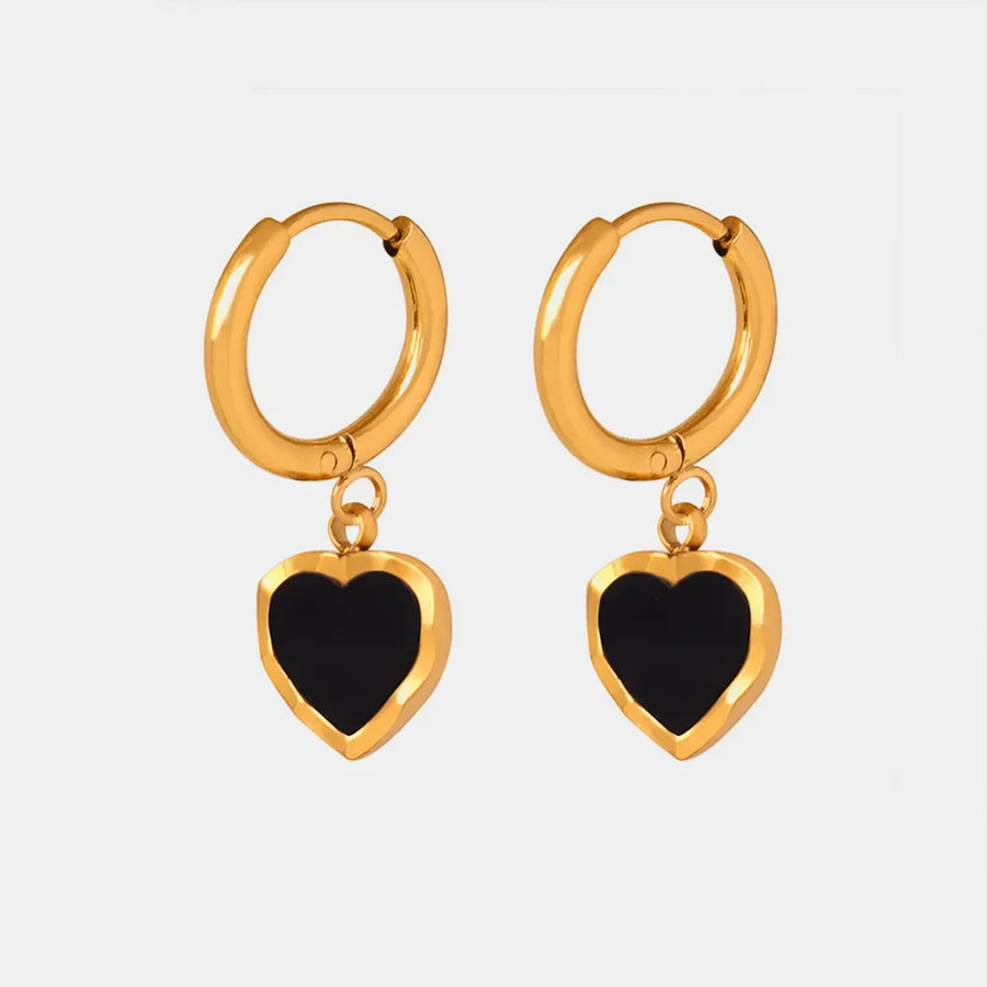 Gold hoop earrings with black enamel heart charms