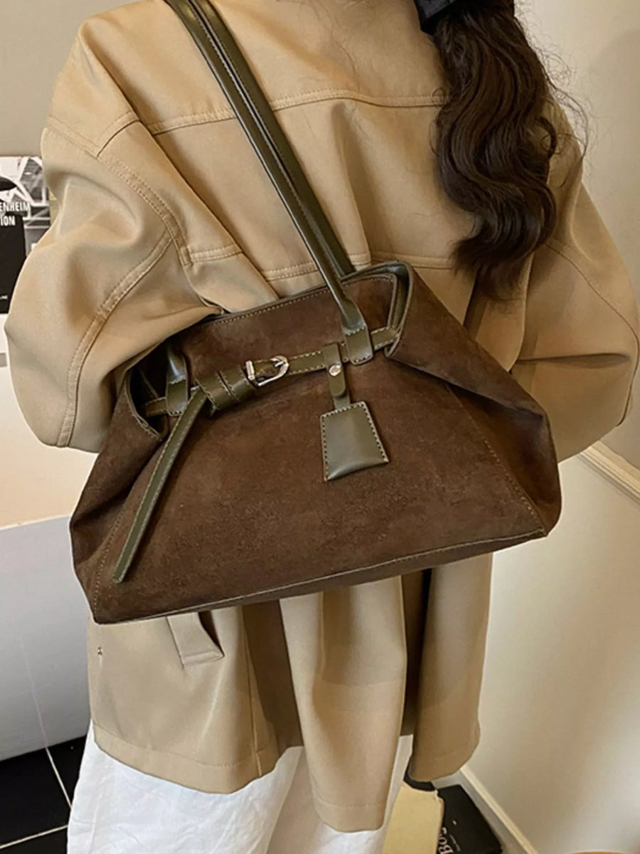 Brown suede shoulder bag with green trim and buckle detail