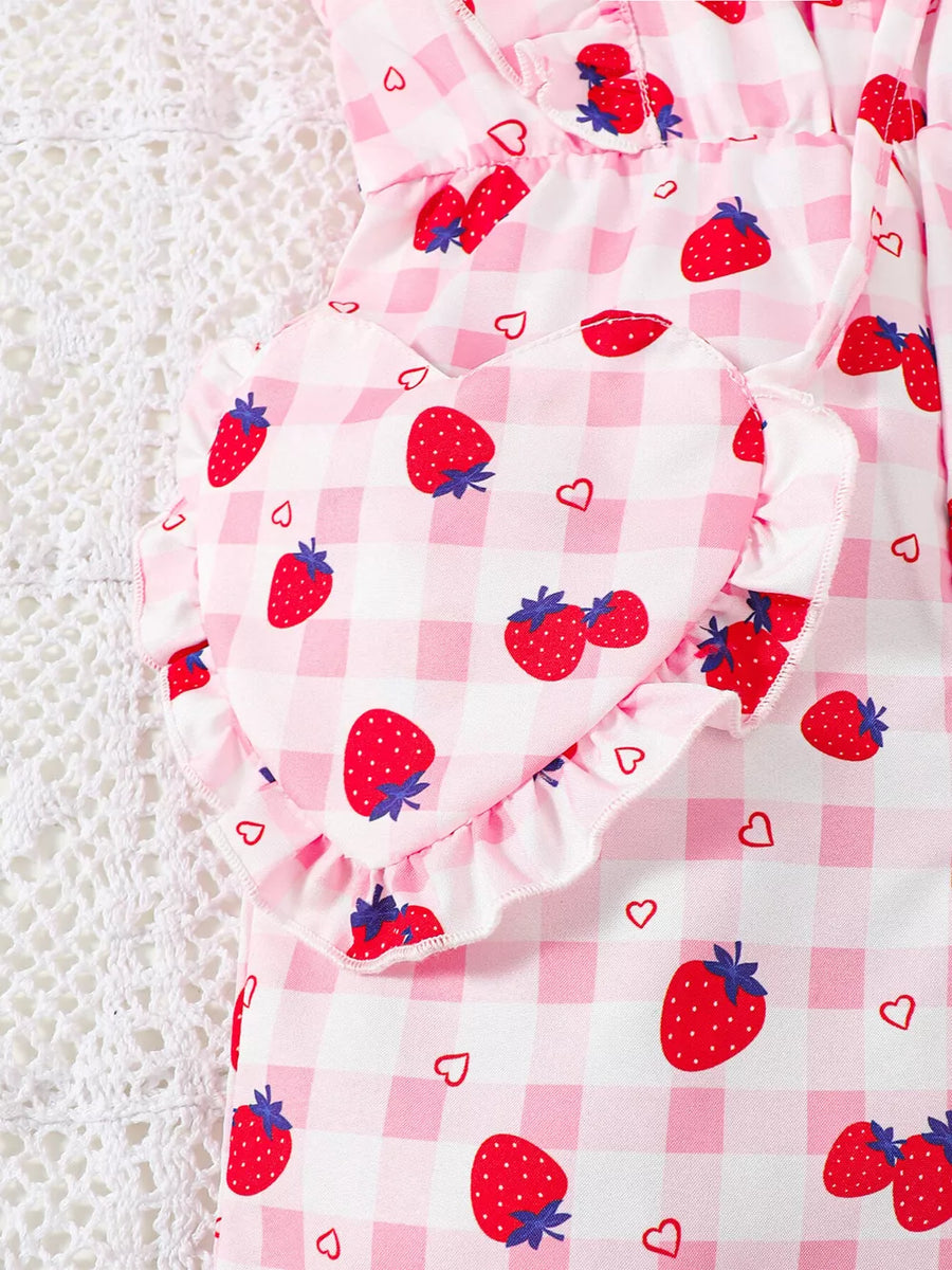 Strawberry ruffle jumpsuit with heart detail and gingham pattern.