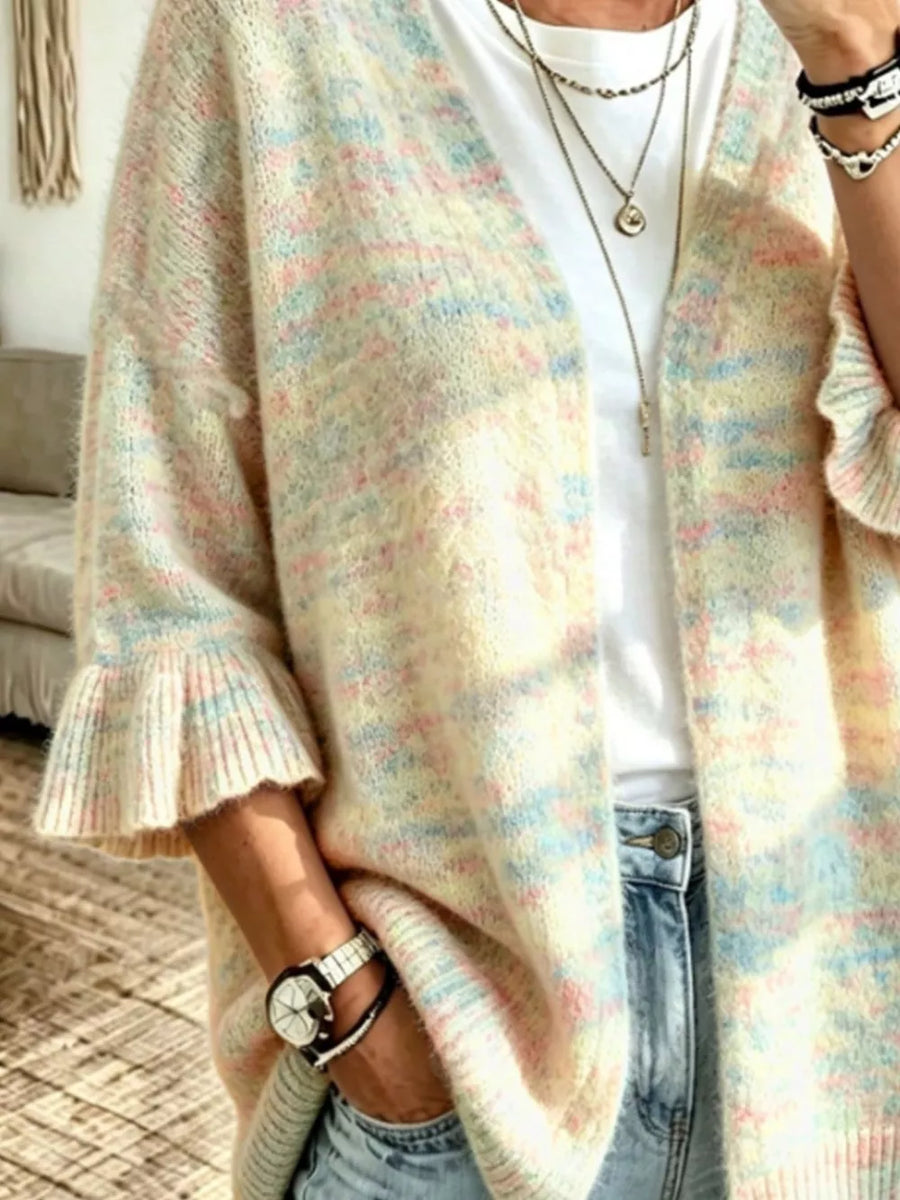 light pink cardigan featuring ruffle sleeve and speckled