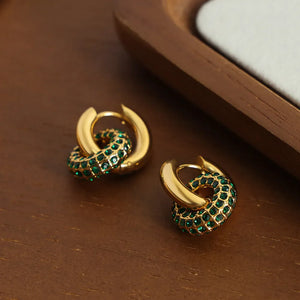 Gold pavé circle interlock hoop earrings with dark green stones