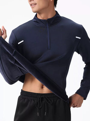 Men's dark navy cotton half-zip sweatshirt with a stand-up collar and subtle reflective accents.