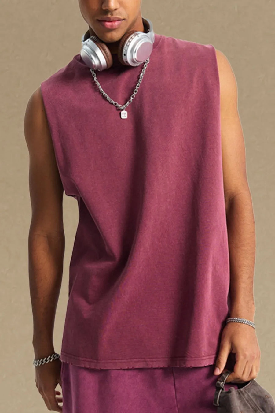 Washed cotton muscle tank in burgundy with a relaxed fit and raw hem.