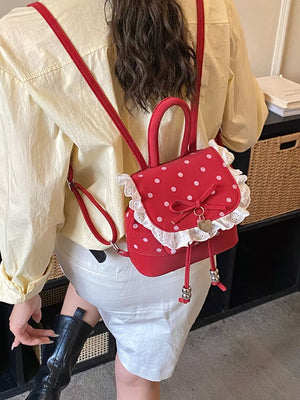 Red backpack with flap and polka dot