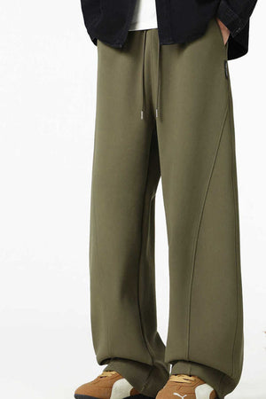 Relaxed wide-leg army green men's sweatpants with drawstring and seam detail