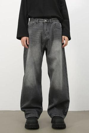 Faded dark gray cotton denim jeans with a wide-leg silhouette.