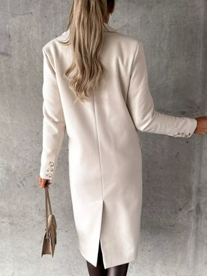 Chic double-breasted longline trench coat in apricot with buttoned cuffs and a back vent.
