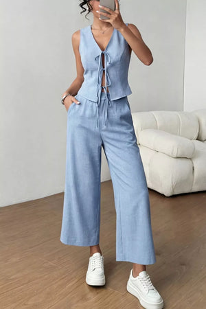Light blue tie-front sleeveless vest and wide-leg pants