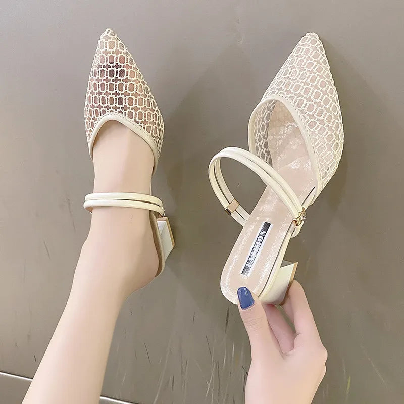 Ivory lace slingback pointed-toe mules with double ankle straps and block heel.