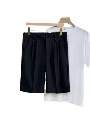 Black pleated chino shorts with pockets, shown with a white t-shirt.