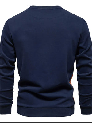 Navy crew neck sweatshirt with color block side panel detail.