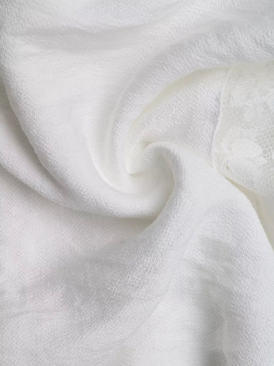 White smocked mini dress with eyelet hem detail