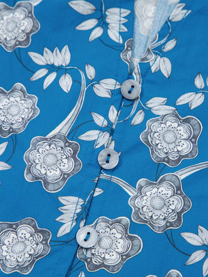 Blue cotton blouse with floral print, button front, and ruffle sleeves.