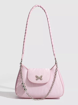Pink shoulder bag with butterfly charm and silver bead chain detail