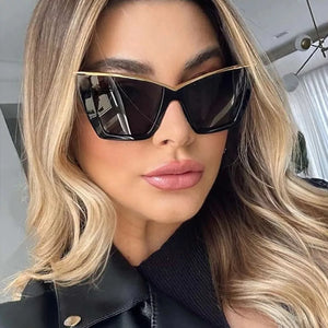 sunglasses in black featuring UV400 protection and cat-eye fit