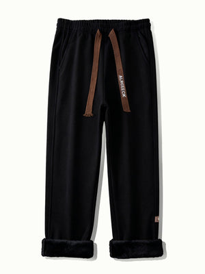 pants in Black with drawstring waist and full-length
