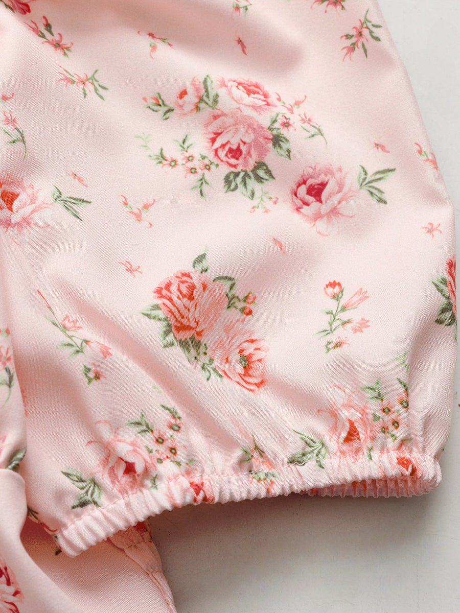 Pink floral tie front puff sleeve blouse with cinched hem