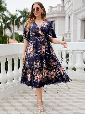 Midnight Bloom Flutter Midi Dress in Floral with V-neck, short sleeves, and tiered ruffles.