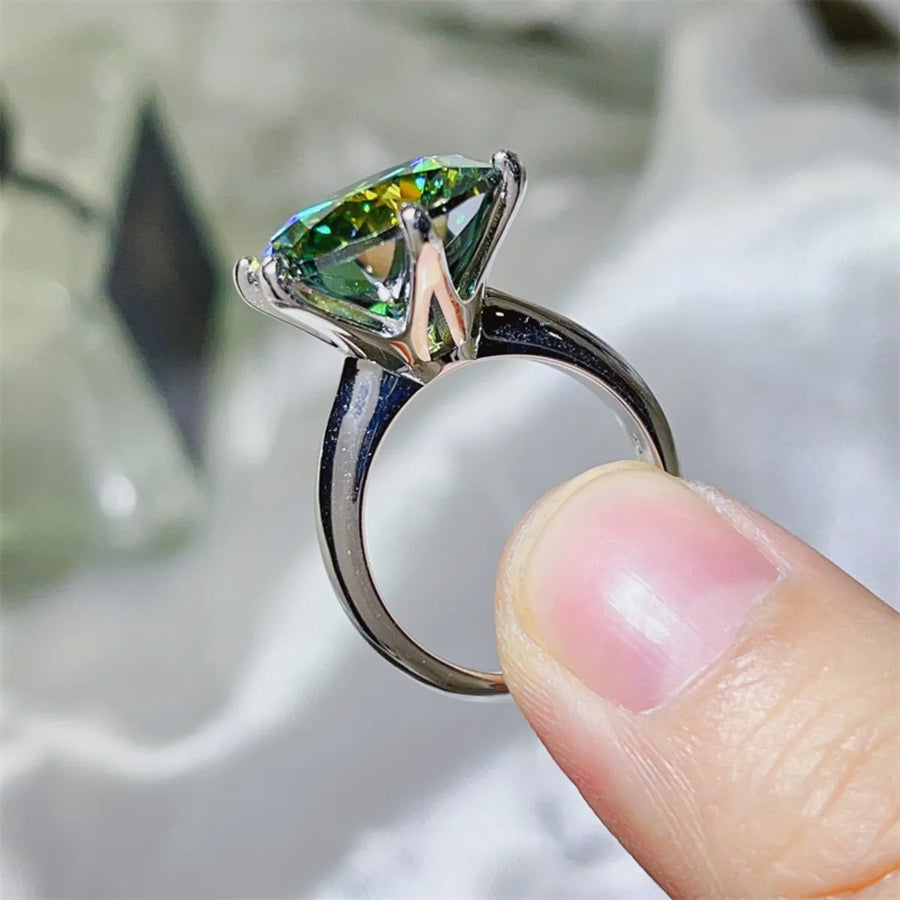 Emerald cut green moissanite solitaire ring in 925 sterling silver.