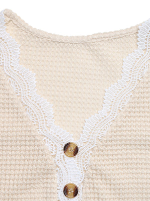 Apricot waffle knit maternity tee with V-neck, lace trim, and button detail.