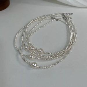 Synthetic Pearl Care instructions: 1 choker necklace in ivory with fitted silhouette