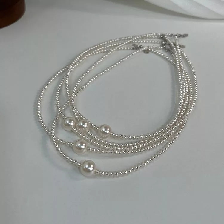Synthetic Pearl Care instructions: 1 choker necklace in ivory with fitted silhouette