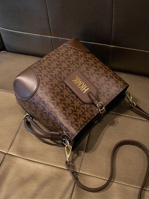 crossbody bag featuring monogram in brown with PU Leather Imported Size & texture