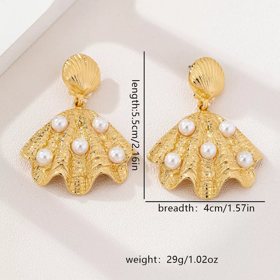 earrings in ivory with shell design and 2.2 inches