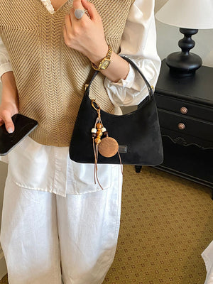 black handbag with small and zip