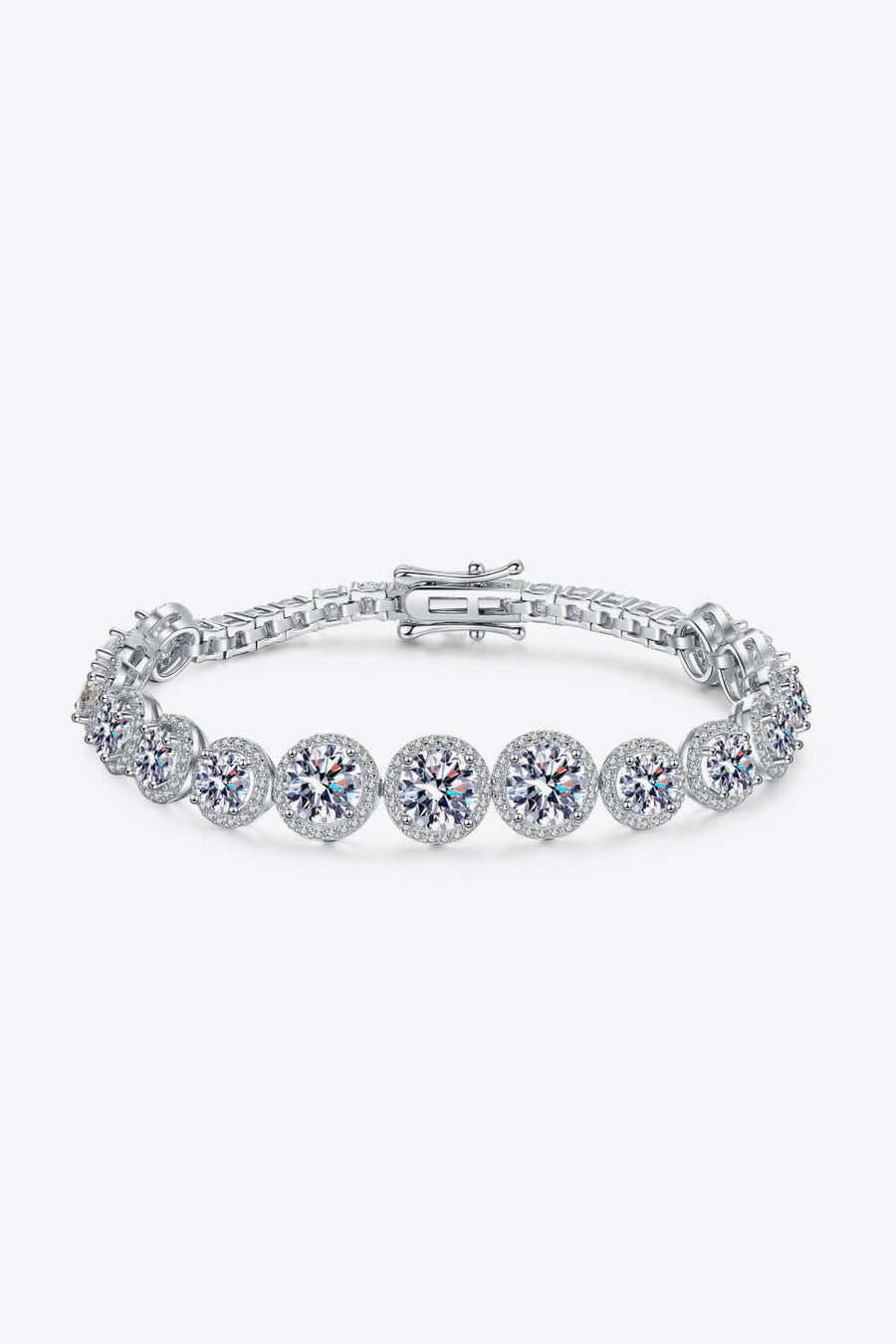 Silver moissanite tennis bracelet with halo detail and clasp closure.