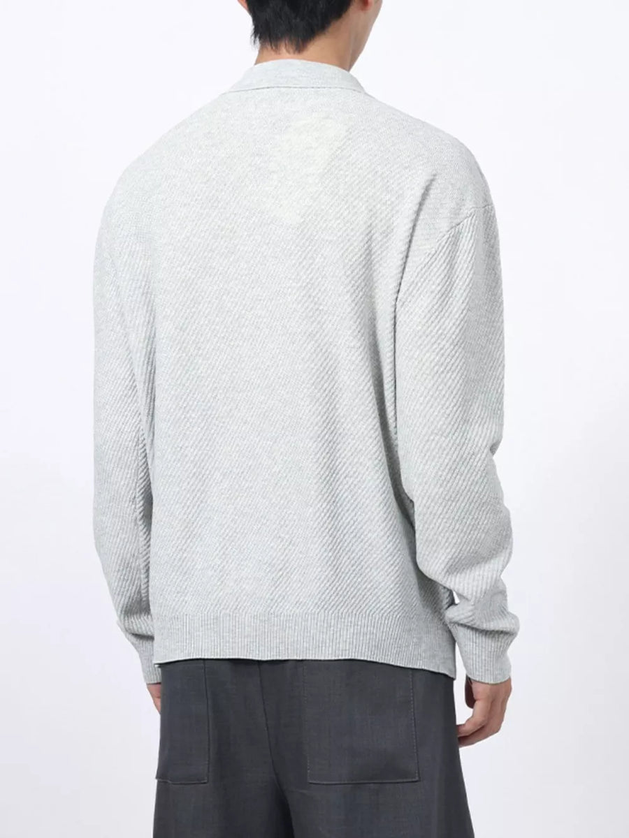 Men's light gray textured knit polo with long sleeves and a classic collar.