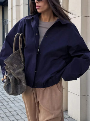 bomber jacket in navy blue featuring buttoned and relaxed fit