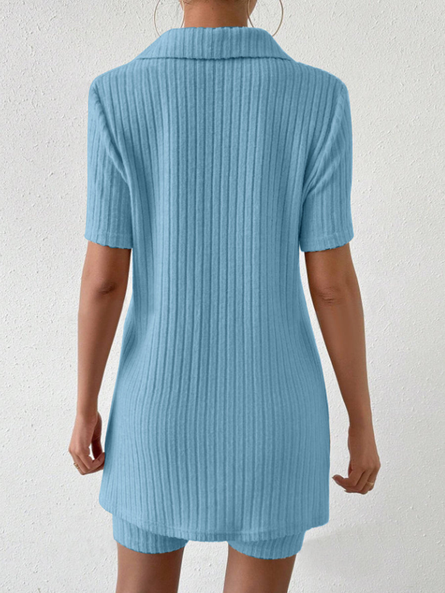 Light blue ribbed polo shirt and shorts co-ord set with short sleeves and collar.
