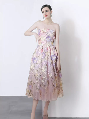 Strapless midi dress in purple pink with 3d floral appliques and a-line skirt.