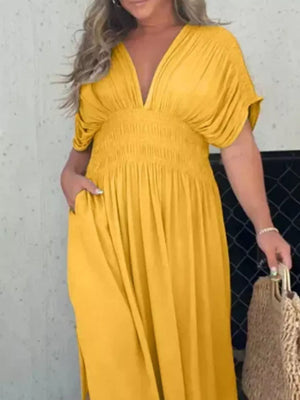 Yellow V-neck dolman sleeve maxi dress with smocked waist and pockets.