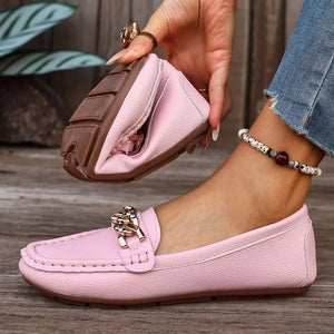 Pink round-toe loafers with chain detail and flexible sole